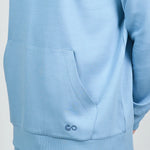 comfiknit-sky-hoodie-placid-blue-side-closeup-male